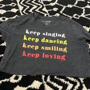 Jerry Leigh Gray Short Sleeve Tee “Keep singing keep dancing keep smiling…”